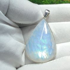 "Natural Moonstone Pendant, 925 Sterling Silver Pendant, Rainbow Fire Necklace, Bohemian Pendant, Wedding Pendant, Anniversary Gift For Her   Gemstone : Moonstone  Metal : 925 Sterling Silver Purity : 925 Parts Of 1000 Style : Boho & Hippi  Jewelry Type : Handmade  Pendant Size Width : 26 mm  Height : 8 mm Length : 49 mm Why Wear Silver As a metal, silver has significant health benefits that have been used across cultures for centuries. Silver has a proven track record as a powerful antimicrobial agent fighting infection and aiding in cold and flu prevention wound healing, and more. Silver also helps with internal heat regulation and circulation. ♥ Packaging: All jewelry comes in a beautiful and careful packaging 🛍 If the item is going directly to the gift recipient please leave us a note Fusion Style Moonstone Gemstone Jewelry, Mystical Teardrop Gemstone Jewelry, Celestial White Gemstone Jewelry, Moon Shaped Natural Stones Jewelry For Anniversary, White Sterling Silver Jewelry With Gemstone, Fusion Style Moonstone Jewelry For Anniversary, Mystical White Sterling Silver Jewelry, White Mystical Pendant Jewelry, Mystical White Pendant Jewelry