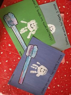 three children's handprinted cards with toothbrushes and skulls on them