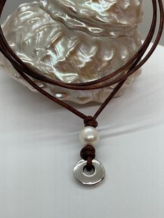 Dark Cherry Brown leather is the base for this modern and trendy pendant necklace. This necklace was handcrafted on a 2mm dark brown cherry leather. If you have never owned a leather necklace you will enjoy the casual elegance of the leather. When the raw leather is dyed the stain absorbs into the leather to cover over its' natural color. There are definite variations in the intensity of color on this leather and that just adds to the coastal/bohemian style and appeal. Some people intentionally Minimalist Leather Jewelry With Adjustable Cord, Minimalist Adjustable Leather Necklace, Adjustable Minimalist Leather Necklace, Minimalist Everyday Leather Necklace, Brown Waxed Cord Necklace For Everyday, Brown Leather Necklace For Gifts, Elegant Leather Necklace With Adjustable Cord, Brown Minimalist Necklace With Adjustable Cord, Minimalist Brown Necklace With Adjustable Cord