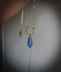 This is a handmade 46 cm/18 in necklace made with 14K gold filled chain and wire, a hammered 12 mm ring, a marquise shaped labradorite stone with a beautiful indigo blue coloured flash and a lobster clasp closure. Gold Filled Ring, Hammered Gold, Ring Pendant, Ring Pendant Necklace, Labradorite Stone, Gold Filled Chain, Indigo Blue, Crystal Necklace, Lobster Clasp