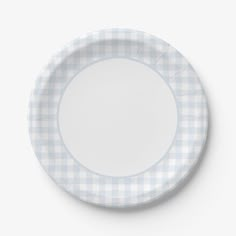 a white and blue checkered plate on a white surface