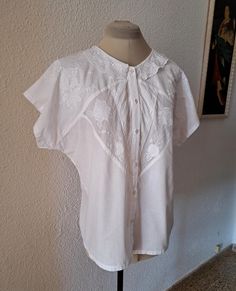 White cotton blouse embroidered, small collar, button up, 100% cotton, made in India, marked size M. Very good vintage condition. flat measurements: armpit to armpit - 59 cm/ 23.2'' waist - 54 cm/ 21.2'' length - 61 cm/24'' Collared Blouse With Floral Embroidery For Daywear, Embroidered Cotton Collared Blouse, Floral Embroidered Collar Blouse For Daywear, Floral Embroidery Collar Blouse For Daywear, Daywear Blouse With Floral Embroidery And Collar, Floral Embroidery Blouse With Collar For Daywear, Traditional Button-up Cotton Blouse, Cotton Button-up Tops With Lace Collar, Embroidered Cotton Collar Tops