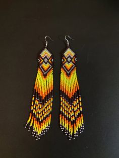 Unique, extra long earrings. Bright yellow orange color. Hypoallergenic clasp Length 6.5 inches (17cm) Width 1 inch (2.5 cm) If you want these earrings in a different color, write to me and I will gladly make them for you. Long Beaded Earrings, Native Earrings, Extra Long Earrings, Beaded Earrings Native, Native American Beaded Earrings, Orange Earrings, Native American Beading, Ear Candy, Earrings Dainty