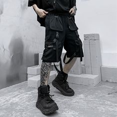 Master the concrete Jungle with our techwear shorts: when style meets performance. Discover our new streetwear shorts – the epitome of city-life fashion. Merging the thrilling world of tech clothing with the convenience of everyday apparel, these shorts reflect a unique symphony of style and function. Designed for the modern urbanite, these black techwear shorts features multiple front pockets, buckles, and straps, adding rich texture and a sophisticated tactical aura to your outfit, guaranteed to attract attention and keep rivals at bay. On a balmy summer night, when the city calls you to roam its shadowy streets, our shorts promise comfort and an unforgettable cyber ninja style. Wave goodbye to the day's stifling heat and embrace the cool, nocturnal breeze. The city streets are your runw Urban Streetwear Cargo Shorts, Streetwear Shorts With Functional Pockets, Urban Cargo Shorts With Pockets For Streetwear, Short Cargo Techwear Bottoms, Hip Hop Streetwear Shorts With Pockets, Urban Style Summer Cargo Shorts, Summer Streetwear Techwear Shorts, Summer Streetwear Shorts With Functional Pockets, Summer Streetwear Shorts With Belt Loops