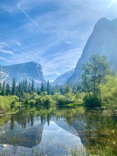 the sun shines brightly on a mountain lake in yose national park, california