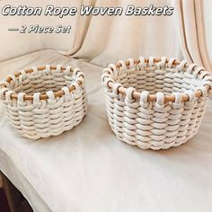 two woven baskets sitting on top of a white table next to each other, with the words cotton rope woven baskets 2 pieces set