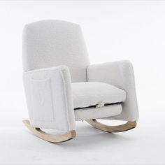 a white rocking chair with a wooden base and armrests, on a white background