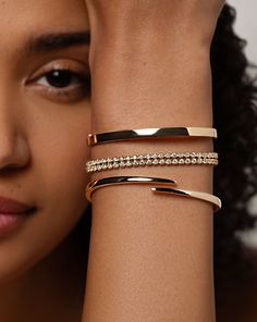 14k solid gold Width: 4 mm, 5 mm, and 6 mm Oval, hinged bangle Push clasp with safety latch Solid Gold Bangle, Wrist Stack, Wrist Stacks, Bracelet Size Chart, Kids Rings, Luxe Jewelry, Bangles Jewelry Designs, Kids Earrings, Stacked Bangles