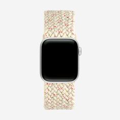 an apple watch with white woven band and red stitching on the front, side view