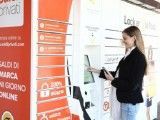 a woman standing in front of a vending machine