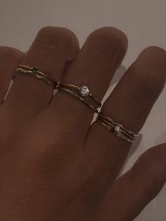 Product Description Truly a classic stacking ring that your ring collection can't live without! Featuring a tiny Emerald solitaire ring made with sparkly band and an even more sparkly cz gemstone. Crafted in 14k gold fill, it's comfortable and suitable for everyday wear. …………………………………. D E T A I L S • Available from US 5 to 8• Band width measures 1mm• 2mm cubic zirconia in emerald• Tarnish-resistant, waterproof, and safe for sensitive skin• 100% 14K Gold Filled• Build your ring stack and save up Emerald Wedding Stack, Ring Placement Meaning Fingers, Everyday Ring Stack, Dainty Ring Stack, Rings Stack, Emerald Solitaire Ring, Ring Stacks, Mixed Metal Rings, Emerald Wedding