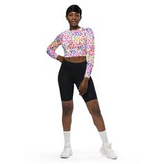 This long-sleeve crop top is made of recycled polyester and elastane, making it an eco-friendly choice for swimming, sports, or athleisure outfits.  The crop top has a tear-away care label and a wide, double-layered waistline band for a comfortable fit.  * Fabric composition in Europe: 88% recycled polyester, 12% elastane * Fabric weight in Europe: 6.78 oz/yd² (230 g/m²) * Fabric composition in the US: 81% REPREVE recycled polyester, 19% LYCRA® XTRA LIFE™ * Fabric weight in the US: 7.52 oz/yd² ( Deep Ocean, Cropped Tops, Athleisure Outfits, Purple Rain, Care Label, Wide Waistband, Athletic Women, Long Sleeve Crop Top, Doodle Art