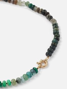 The Encirkled Camo Gemstone Beaded Necklace is the ultimate addition to your neck stack, featuring a 14k spring ring closure, that is perfect for displaying your favorite charms. 8mm assorted gemstones that may include agate, amber, aquamarine, aventurine, cat's eye, chocolate moonstone, chrysoprase, emerald, fluorite, chrysocolla, green onyx, jasper, labradorite, malachite, pyrite, sapphire, smoky quartz, tourmilated quartz Gemstone card comes with each necklace with list of included gemstones Neck Stack, Gemstone Beaded Necklace, Authentic Jewelry, Green Onyx, Smoky Quartz, Ring Bracelet, Spring Rings, Earring Necklace, Gemstone Necklace