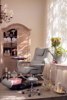 an office chair sitting in front of a desk with a vase on top of it