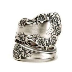 two silver rings with flowers on them