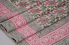 four pieces of pink and grey fabric with floral designs on the edges, all in different colors