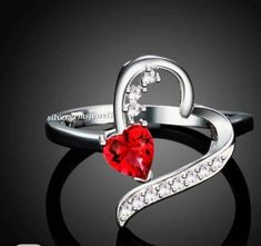 Heart-shaped White Gold Birthstone Ring For Valentine's Day, White Gold Rings For Valentine's Day, Valentine's Day Silver Heart Birthstone Ring, Silver Heart Ring For Proposal On Valentine's Day, Red Heart-shaped Birthstone Ring, Silver Heart-shaped Birthstone Ring, Valentine's Day Red Cubic Zirconia Heart Ring, Silver Heart Birthstone Ring For Proposal, Heart-shaped Ruby Ring With Diamonds As A Gift