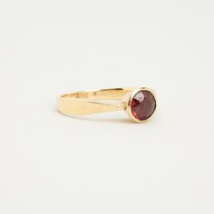 R I N G WITH RED GARNET ∙  * Details: Solid Gold ∙ 14K Gold ∙ Yellow Gold * Stones: red garnet * Weight: 2.67 grams * Ring size: 6¾ * Condition: All our pieces are vintage, antique or close to new. Each piece undergoes a rigorous quality control, including x-ray testing, ultrasonic cleaning, purity testing, diamond testing, and overall quality checks to ensure condition. Detailed condition descriptions are provided in each product listing. * All our pieces are expertly handpicked in Denmark. We Product Listing, Red Garnet, Elegant Jewelry, Denmark, Garnet, Vintage Antiques, Solid Gold, Jewelry Box, Jewelry Rings