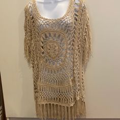 Tan Color M Handmade Design With Intricate Detail. Has The Same Design On Back. With Strong Dangles On Bottom And Sleeves. Summer Knit Tops With Fringe, Summer Knit Top With Fringe, Bohemian Knit Tops With Fringe, Bohemian Knit Crochet Dress, Casual Beige Crochet Dress With Crochet Trim, Casual Beige Crochet Trim Dress, Beige Knit Crochet Top For Beach, Beige Crochet Dress With Crochet Trim For Festival, Beige Crochet Dress For Festival