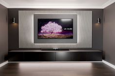 a large television mounted on the side of a wall