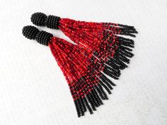 Elegant Red Tassel Earrings With Dangling Beads, Gift Beaded Tassel Earrings With Round Beads, Red Fringe Tassel Earrings With Round Beads, Red Tassel Earrings With Fringe And Round Beads, Fringe Earrings With Round Beads As Gift, Red Tassel Earrings With Round Beads As Gift, Elegant Red Beaded Earrings With Fringe, Elegant Red Beaded Fringe Earrings, Red Beaded Fringe Tassel Earrings With Round Beads