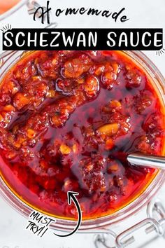 homemade schezwan sauce in a glass bowl with text overlay above it