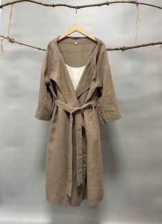 "A super versatile and multifactional open front knee length cardigan/jacket to keep you warm and chic. 100% linen construction, loose and stylish, comfy and easy to throw on with any outfit. A timeless piece made for many kinds of weather and occasions. - 100% Medium weight linen - Open front with removable belt - Knee length - Two side welt pockets - Bracelet sleeves Please provide your shoulder width, full bust measurement ( measured around the fullest part) and your height in the note to sel Oversized Solid Color Open Front Outerwear, Oversized Open Front Solid Color Outerwear, Linen Cardigan Outfit, Long Summer Outerwear With Pockets, Oversized Beige Outerwear For Summer, Casual Long Coat For Summer, Summer Wrap Outerwear For Layering, Casual Beige Outerwear For The Beach, Oversized Chic Outerwear For Beach