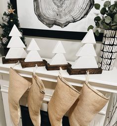 christmas stockings hanging from a fireplace mantel