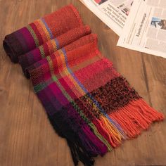 This vibrantly-colored scarf is inspired by the Andean custom of using many colors when dressing for the holidays. The cheerful scarf is woven on a traditional loom using 100% alpaca wool yarns. Long fringe accents both ends. Handwoven Tapestry, Alpaca Scarf, Long Fringe, Striped Scarves, Wool Shawl, Fall 2022, Alpaca Wool, Craft Work, Lovely Colors