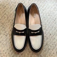 New In Box, Gorgeous Black And White Loafers From Tod’s. Size 39. Purchased From Net-A-Porter. Box And Dust Bag Included. Classic White Loafers For Work, White Business Loafers With Flat Heel, White Wingtip Loafers For Work, White Almond Toe Loafers For Galas, White Brogue Loafers For Office, White Flat Heel Business Loafers, Formal White Loafers With Rubber Sole, White Loafers With Rubber Sole For Work, White Brogue Loafers For Work