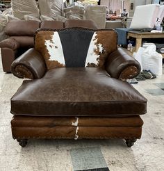 a brown and white chair sitting on top of a checkered floor