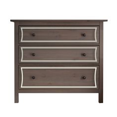 a brown dresser with three drawers and white trim