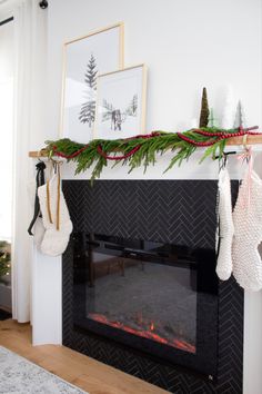 stockings hanging from the mantle in front of a fireplace