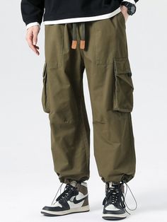 Experience the perfect blend of comfort and style with our Drawstring Cuff Parachute Cargo Pants. Made from high-quality cotton, these pants provide a soft and comfortable feel. The adjustable drawstring cuffs offer a personalized fit, while the multiple cargo pockets provide ample storage space. Enhance your casual ensemble effortlessly with this versatile piece. Specifications: Material: Cotton Package included: 1*Pants. Size Chart (inches): Size Waist Hip Length XS 27.6 44.1 38.6 S 29.1 45.7 Cotton Drawstring Sweatpants With Tapered Leg, Cotton Sweatpants With Drawstring And Tapered Leg, Cotton Drawstring Tapered Leg Pants, Baggy Cotton Drawstring Sweatpants, Baggy Cotton Joggers With Ribbed Cuffs, Spring Cotton Joggers With Elastic Cuffs, Cotton Sweatpants With Cargo Pockets For Loungewear, Green Relaxed Fit Pants With Elastic Cuffs, Utility Cotton Joggers