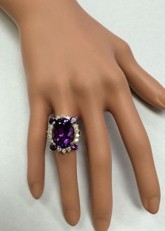 16.85 Carats Natural Amethyst and Diamond 14K Solid Yellow Gold Ring Suggested Replacement Value: $6,700.00 Total Natural Oval Shaped Amethyst Weights: Approx. 16.00 Carats Natural Round Diamonds Weight: Approx. 0.85 Carats (color G-H / Clarity SI1-SI2) Ring total weight: Approx. 12.00 grams Disclaimer: all weights, measurements and colors are approximate and may vary slightly from the listed dimensions or as seen in the image. All pictures are magnified to show the smallest of details. Please, Elegant Amethyst Rings For Parties, Elegant Amethyst Party Rings, Luxury White Gold Amethyst Ring With Gemstone Accents, Exquisite Purple Diamond Rings, Purple Ring With Gemstone Accents For Formal Occasions, Luxury Amethyst Ring For Anniversary, Luxury Multi-stone Amethyst Wedding Ring, Luxury Multi-stone Amethyst Ring For Weddings, Elegant Amethyst Ring With Gemstone Accents For Anniversary