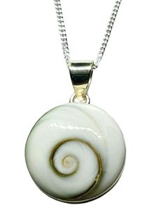 "Shivas Eye , Pacific Cats Eye Pendant  18\" Trace Chain Sterling 925 Silver  Buddhist Hindi  With Shiva Eye Shell Pendant Width: 15mm  x 5mm Price includes a 46cm (18\")  Curb Trace Chain in Sterling Silver This listing is for ONE Pendant & Necklace. Shiva eye shells, also known as Pacific Cat's Eye, are found in the seabeds of Thailand, Indonesia, and Australia.  This uniquely swirling shell is actually the protective door at the opening of a Turban snail's shell,  which detaches at the end of White Sterling Silver Amulet Necklace, Shiva Eye, Necklace Shell, Eye Pendant Necklace, Protection Amulet, Rare Crystal, Cats Eye, Ancient Symbols, Eye Pendant