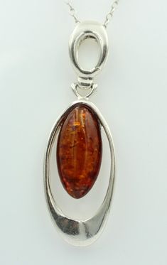 Design Pendant     This beautiful design pendant is made of high quality 925 sterling silver. The trailer is with eyelet about 4.7 cm and without eyelet a size of about 3.5 x 1.5 cm and a weight of about 5.7 gr. The trailer has a modern design. Inside, a brown amber about 2.1 x 1 cm in size was artfully framed. A dream of a trailer   Type: Trailer Material: 925 Sterling Silver Size with eyelet approx. 4.7 x 1.5 cm Weight: approx. 5.7 gr Stone: 1 x Amber 2.1 x 1 cm     On the additional pictures Amber Pendant, Amber Necklace, Silver Spoons, Silver 925 Necklace, Pendant Necklaces, Chains Necklace, Favorite Jewelry, Beautiful Design, Jewelry Necklace Pendant