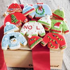 decorated christmas cookies in a wooden box