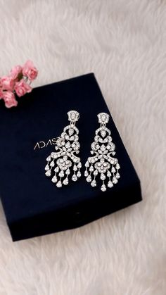 All of the products are MADE TO ORDER in India. They are handcrafted by me and my expert artisan team. *Gemstone Grade: AAAAA (Natural Diamond Coated) *Base Metal: 925 Sterling Silver *Plating: Rhodium Plated *Gemstone: Cubic Zirconia         SKU : AAER_DE_396 *PLEASE NOTE* *   This product is completely eco-friendly and non-aggressive to all skin type.  *   It does NOT contain nickel, cadmium, or lead. Find more amazing products like Rings, Earrings, Necklace, Brooches, Bracelets, Tiara at our Hand Set Crystal Dangle Earrings, Hand Set Sterling Silver Chandelier Earrings As Gift, Sterling Silver Hand Set Chandelier Earrings As Gift, Hand-set Crystal Dangle Earrings, Dazzling Cubic Zirconia Chandelier Earrings As Gift, Cubic Zirconia Chandelier Earrings With Diamond Accents, Cubic Zirconia Chandelier Earrings With Diamond Accents As Gift, Chandelier Earrings With Diamond Accents As Gift, Gift Chandelier Earrings With Diamond Accents