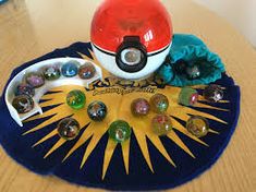 a pokemon poke ball game sitting on top of a table