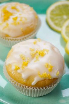 two lemon cupcakes with icing on a plate