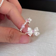 📌 Please Note: When adjusting the ring, please squeeze or expand the ring body slowly and gently. 💎 Materials: 18k White Gold Plated over Solid Sterling Silver Body - Hypoallergenic and Tarnish-Free Cubic Zirconia Matte Finish 📐 Size: Adjustable Open Design - Size 5+ Cute Pink Rings, Silver Girly Jewelry, Adjustable Diamond White Rings As Gift, Diamond White Rings Gift, Gift Open Ring Couple Rings In Diamond White, Diamond White Open Couple Rings Gift, Diamond White Open Ring For Couples As Gift, Diamond White Open Couple Rings As Gift, Diamond White Crystal Open Ring Gift