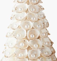 a christmas tree made out of seashells and pearls