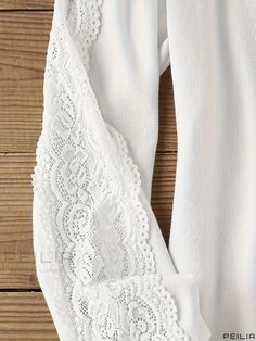 Peilia - Premium Lace-stitched T-Shirt: A Stylish and Versatile Long Sleeve Top for Spring and Fall, Designed for Womens Fashion White Stretch Tops With Lace Trim, White Stretch Top With Lace Trim, White Crew Neck T-shirt With Lace Trim, White Lace Trim Crew Neck Top, White Crew Neck Top With Lace Trim, Casual Fit, Lace Pattern, Sleeve Detail, Sheer Fabrics