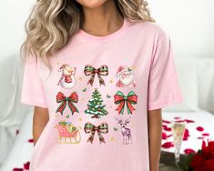 Coquette Christmas Shirt, Pink Bow Christmas Shirt, Pink Santa Shirt, Christmas Shirt, Vintage Christmas Shirt, Retro Christmas Shirt Thank you so much for choosing us! How To Order 1️⃣ Please review all the information provided before placing an order. 2️⃣ Select the shirt type and size using the drop down menu. 3️⃣ Select the color of the shirt using the following drop down menu. 4️⃣ Once all your desired items are in your cart you may complete your order by entering your payment method, desired shipping address and click submit. Shipping Time Shipping will take 1 business days Vintage Christmas Shirt, Retro Christmas Shirt, Coquette Christmas, Pink Santa, Santa Shirt, Bow Christmas, Santa Shirts, Retro Christmas, Pink Bow