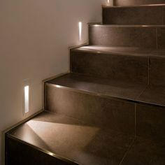 a set of stairs with light shining on them