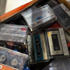 a pile of old cassettes sitting on top of each other