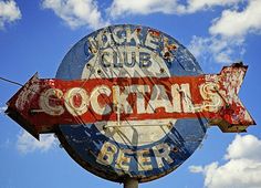 an old neon sign with the word cocktail's on it and a arrow pointing to the right