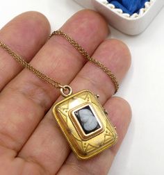 "Vintage gold filled chain and Victorian rectangle photo locket cameo pendant necklace, In good antique vintage condition. The chain 19\" long, Pendant 1\" x 5/8' and ½\" thick. Pendant dates 1890's. Weighs 6.9 gram. Marked 1/20 14k GF on the clasp. Thanks." Swarovski Brooch, Cameo Pendant Necklace, Sterling Silver Marcasite, Cameo Pendant, Photo Locket, Long Pendant, Gold Filled Chain, Moon Stone, Vintage Signs