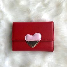 Compact Wallet With Heart On Front. Color Is Red. This Wallet Has 10 Card Slots And 2 Bill Compartments. Brand New, Never Used. Pink Heart-shaped Wallets For Gifts, Pink Heart-shaped Wallet For Gift, Heart-shaped Pink Wallet As Gift, Pink Heart-shaped Wallets For Valentine's Day, Trendy Red Coin Purse For Gift, Trendy Wallets For Valentine's Day Gift, Trendy Red Coin Purse As Gift, Trendy Wallets As Valentine's Day Gifts, Trendy Red Wallet With Card Slots